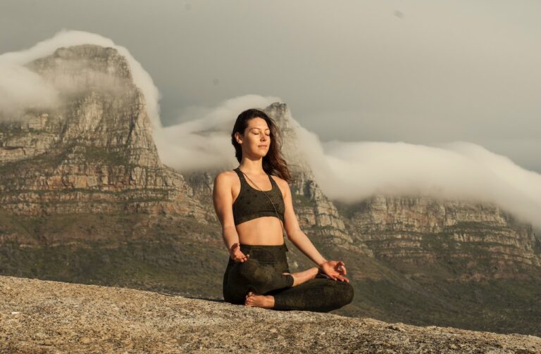 A girl practicing analytical meditation at a peaceful place.